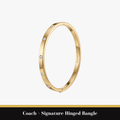 Coach – Signature Hinged Bangle